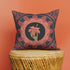 Square pillow cover featuring a golden skeleton hand holding a coral hibiscus flower, surrounded by fan-shaped coral motifs on a black background in an Art Nouveau style.